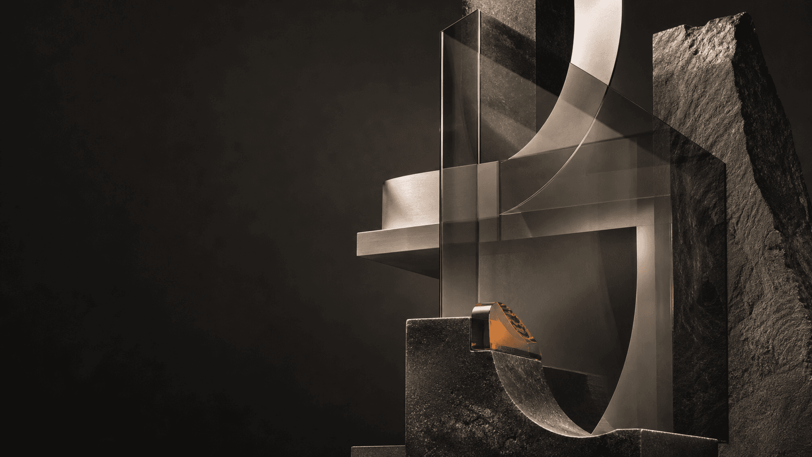 Abstract graphite, glass, and amber sculpture